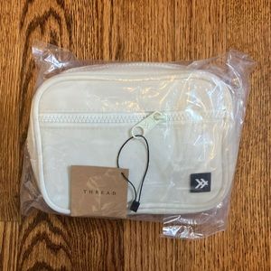Brand new Thread Wallets fanny pack in the color off white.